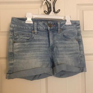 Light denim midi-length shorts